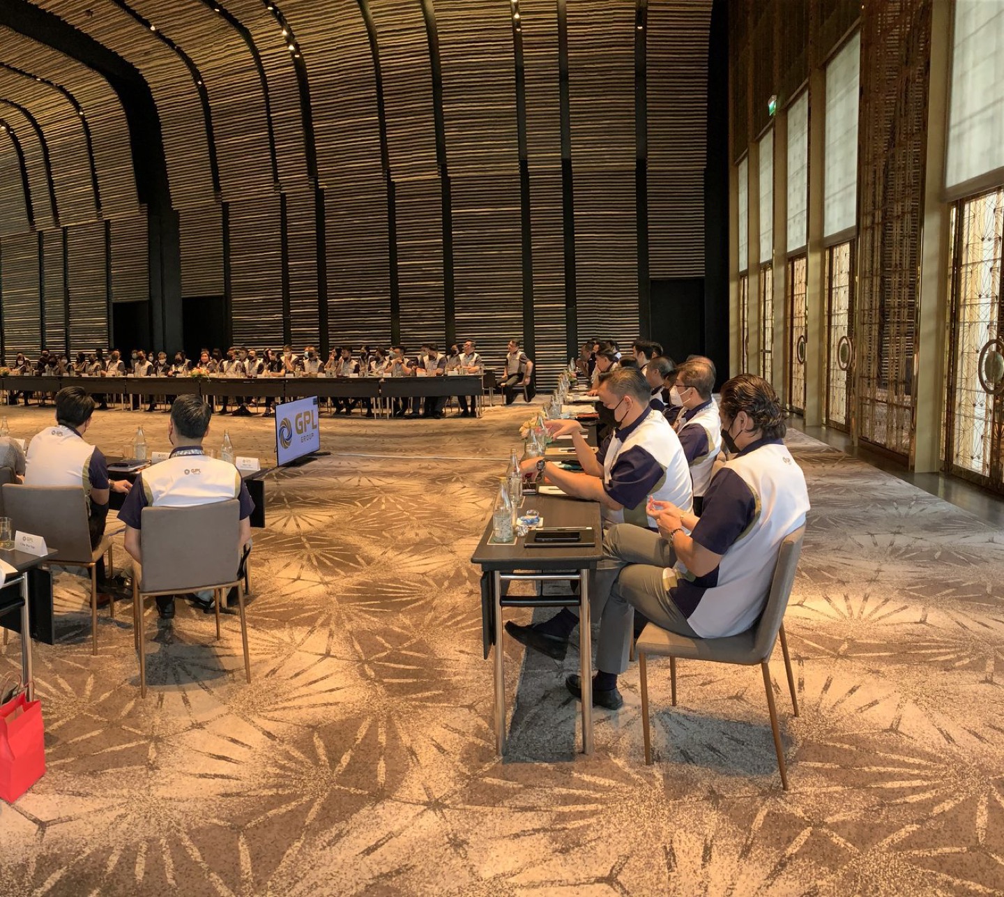 A grand vaulted hall set for Marcus's cohort